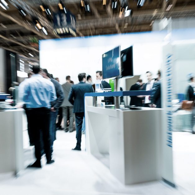 blurred business people trade fair stock photo blurred business people trade fair stock photo
